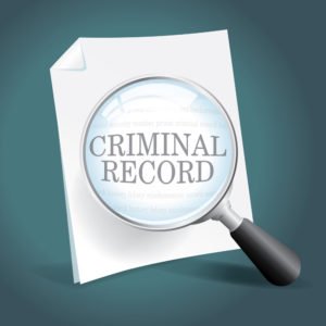 magnifying glass over document that says "criminal record"