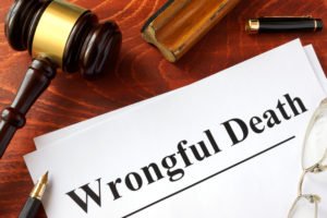 document labeled "wrongful death" with judge's gavel above it