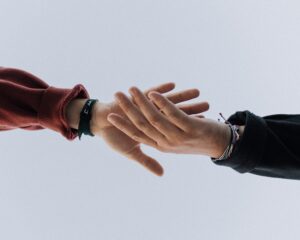 Lawyers in Greensboro, NC- two people holding hands