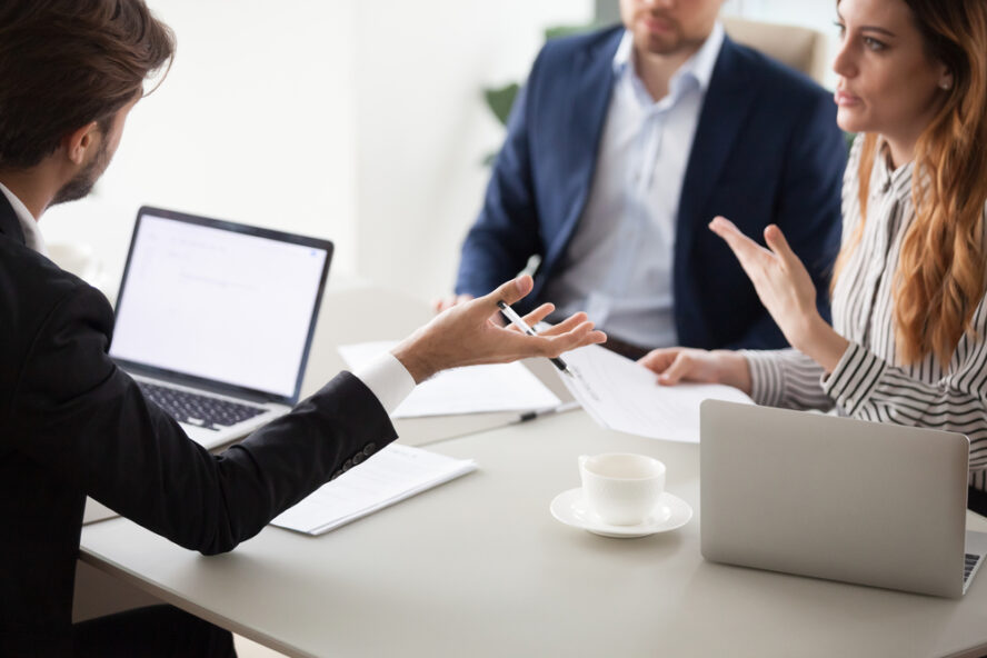 Virginia-Wrongful-Termination-Lawyer - Close up of business colleagues negotiate on contract conditions