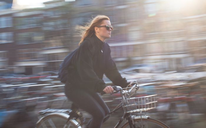 Many choose to bicycle as a form of transport.