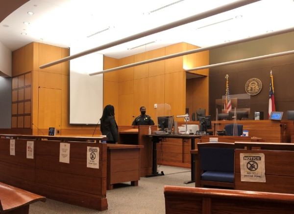 Individual at the courthouse ready for their first court appearance.