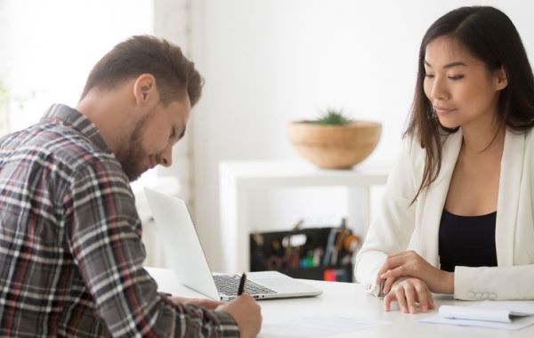 A lawyer providing legal advice and consultation to a client before their first court appearance.