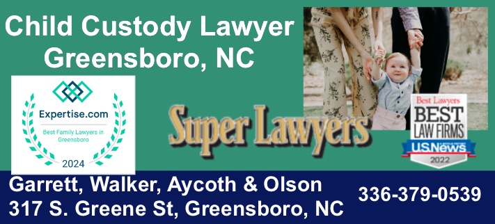Child custody attorney reviewing parenting plan with mother in Greensboro NC office